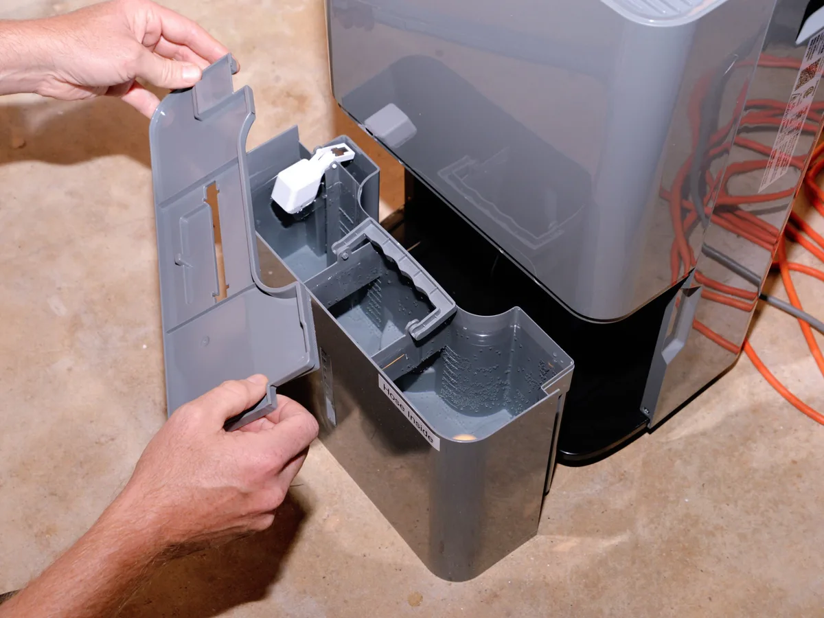 why is my dehumidifier running but not collecting water